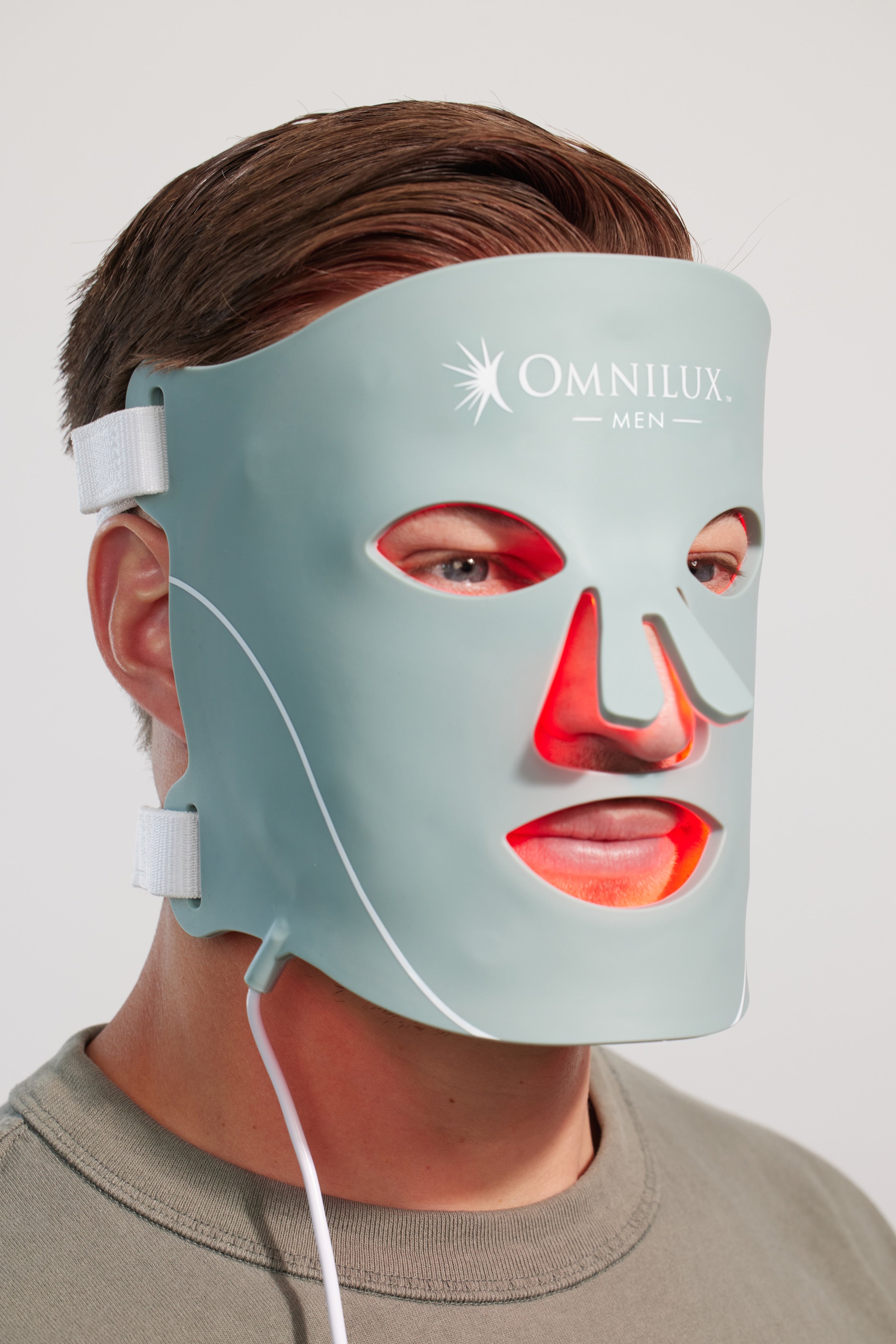 Man wearing Omnilux Contour Men mask for anti-aging light therapy