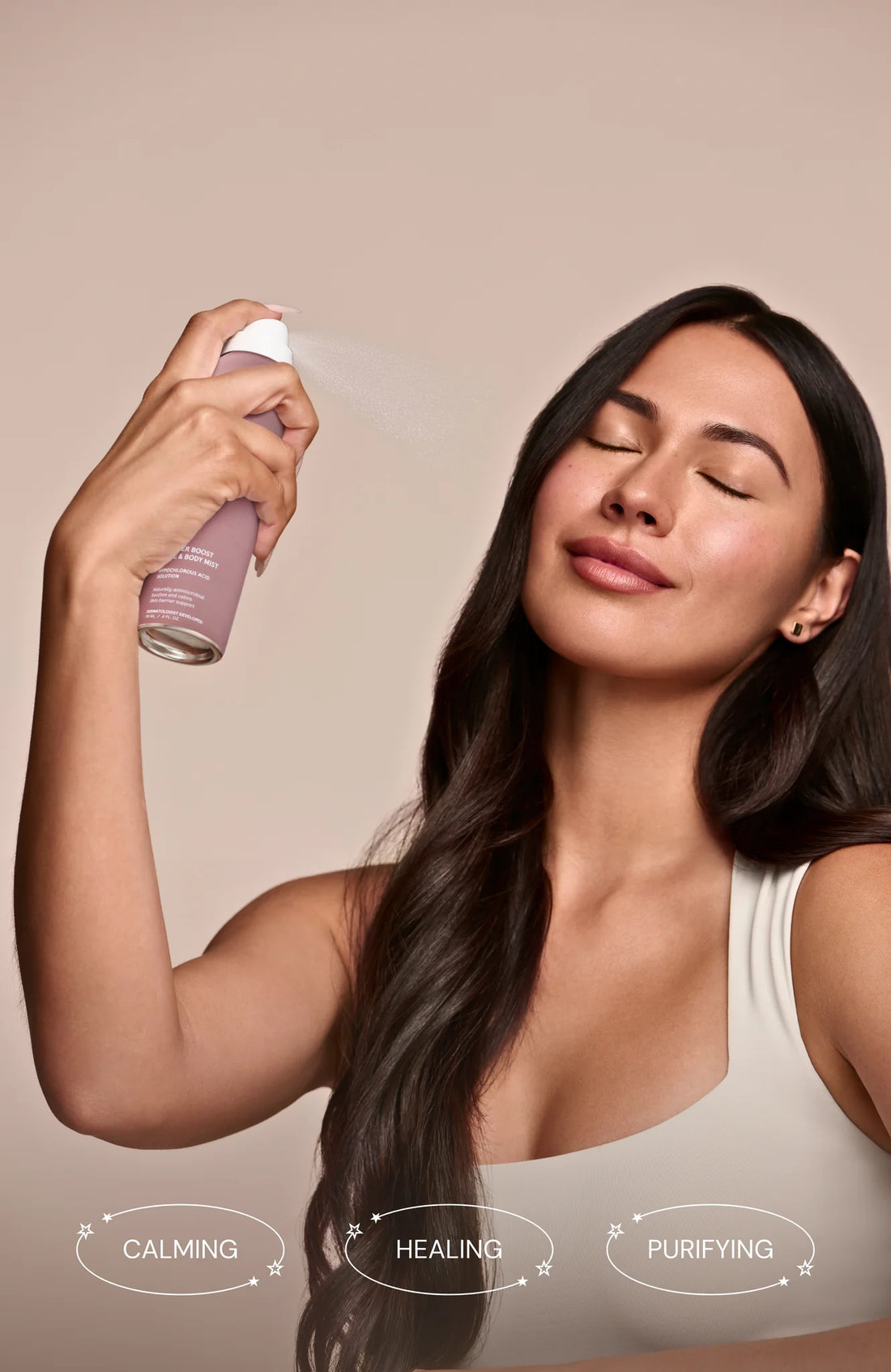 Woman with clear glowing skin using hypochlorous acid face mist, fragrance-free vegan skincare for sensitive skin barrier support