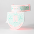 An FDA-cleared, dermatologist-recommended red light therapy device designed for neck and décolleté skin rejuvenation. The device emits red and near-infrared light from its surface.