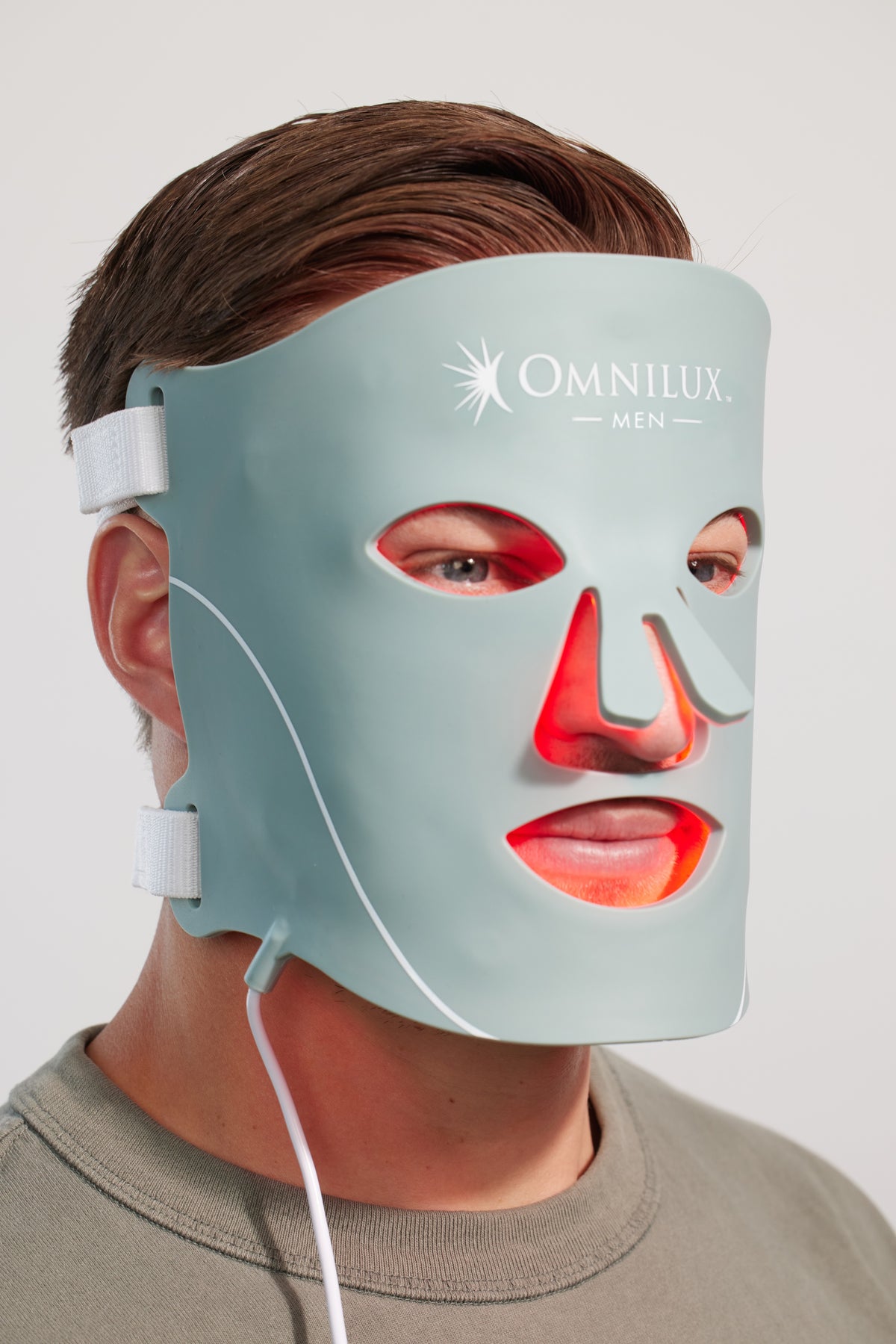 Man wearing Omnilux Contour Men mask for anti-aging light therapy