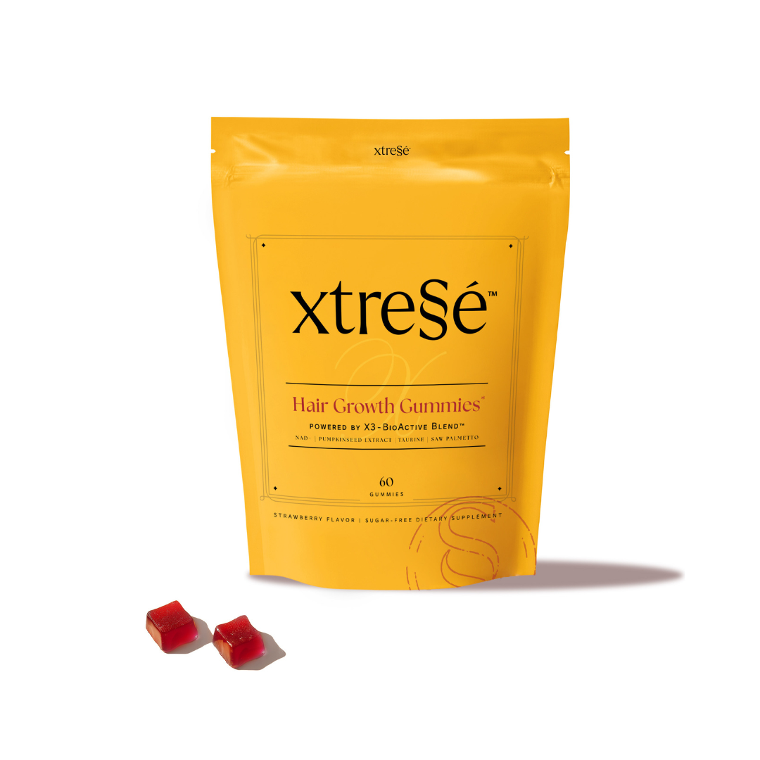 Yellow package of xtresé hair growth gummies on a white background